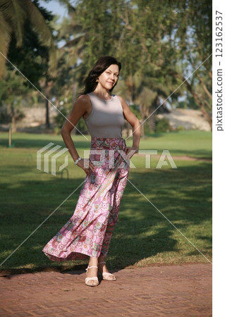 Beautiful woman age model 51 years old posing in a silk skirt in Goa India 123162537