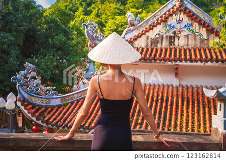 back of a woman tourist traveler at temple on Buddhist pagoda in Vietnam. Travel and tourism in Asia back of a woman tourist traveler at temple on Buddhist pagoda in Vietnam. Travel and tourism in Asia 123162814