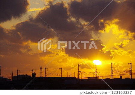 Silhouette of a power pole and the sunset Silhouette of a power pole and the sunset 123163327