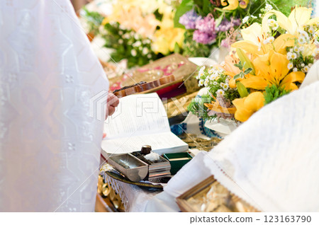 Religious ceremony with open book and cross. 123163790