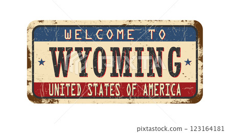 Welcome to Wyoming. An old worn sign with an inscription. Welcome metal plaque with rust elements 123164181