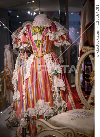Theatrical European vernacular bright pink women's dress of the 19th century with ruffles Theatrical European vernacular bright pink women's dress of the 19th century with ruffles 123164291