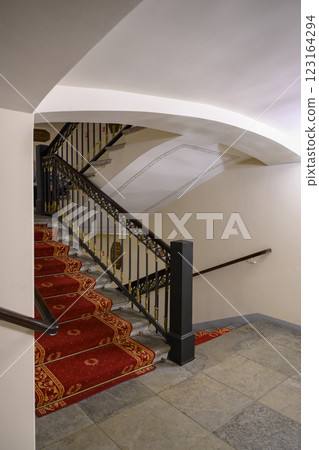 Staircase with carpet and railings in 19th century Alexandrian Theater in St. Petersburg, Russia Staircase with carpet and railings in 19th century Alexandrian Theater in St. Petersburg, Russia 123164294