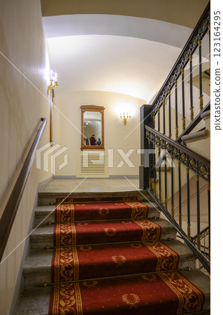 Staircase with carpet and railings in 19th century Alexandrian Theater in St. Petersburg, Russia Staircase with carpet and railings in 19th century Alexandrian Theater in St. Petersburg, Russia 123164295