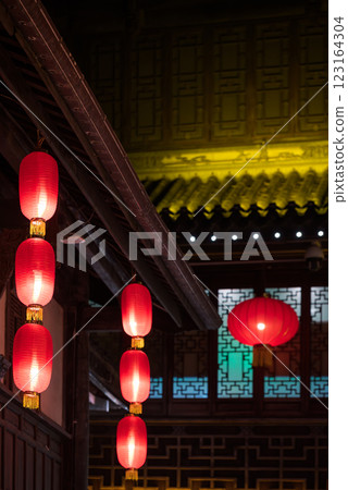 Traditional Chinese Lanterns in a Courtyard at Night Traditional Chinese Lanterns in a Courtyard at Night 123164304
