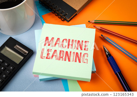 Machine learning concept. Notepad with text on office table Machine learning concept. Notepad with text on office table 123165343