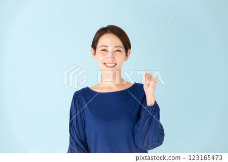 Woman casual portrait fist pump Woman casual portrait fist pump 123165473