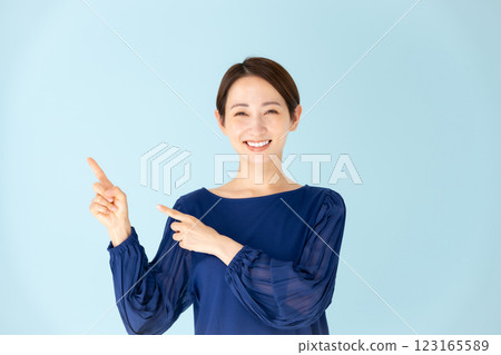 Woman, casual, portrait, pointing 123165589