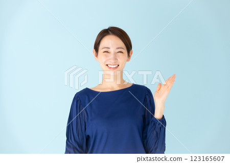 Woman casual portrait hand waving 123165607