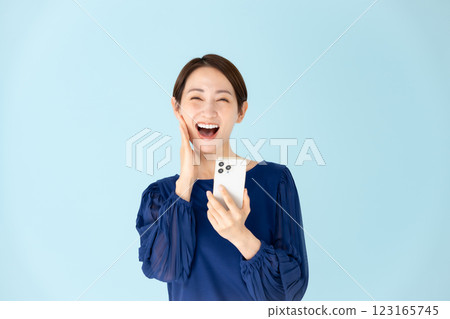 Woman, casual, portrait, smartphone, surprised, smiling Woman, casual, portrait, smartphone, surprised, smiling 123165745