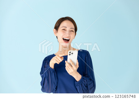 Woman, casual, portrait, smartphone, surprised, smiling Woman, casual, portrait, smartphone, surprised, smiling 123165748