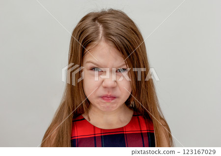 Squeamish caucasian child of 6 7 years on white background 123167029
