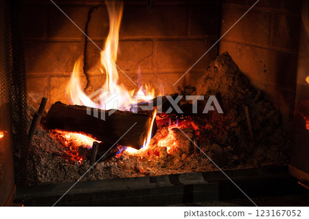 Warm fireplace and flames in winter Warm fireplace and flames in winter 123167052