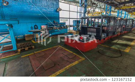 Conveyor assembly stage the body of tractor at big industrial factory timelapse Conveyor assembly stage the body of tractor at big industrial factory timelapse 123167152