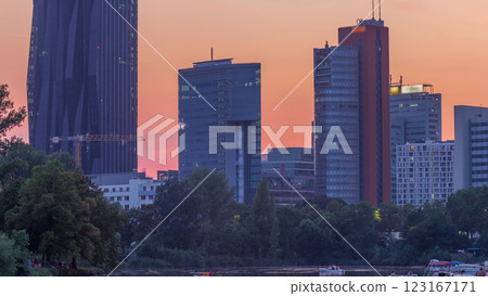 Vienna international center skyscrapers with Kaiserwasser lake reflection view day to night timelapse 123167171