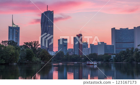 Vienna international center skyscrapers with Kaiserwasser lake reflection view day to night timelapse Vienna international center skyscrapers with Kaiserwasser lake reflection view day to night timelapse 123167173