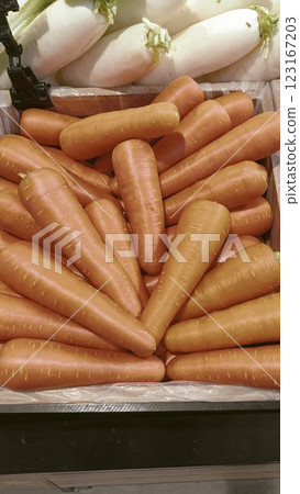 A Fresh orange carrots in wooden crate vibrant, healthy harvest 123167203