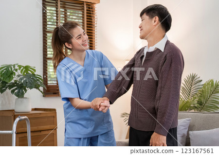 Elderly Caregiver Assisting Retired Man at Home for a Comfortable and Supportive Living Environment Elderly Caregiver Assisting Retired Man at Home for a Comfortable and Supportive Living Environment 123167561