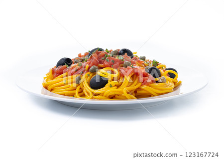 Italian Pasta puttanesca with tomato sauce, capers, and black olives. 123167724