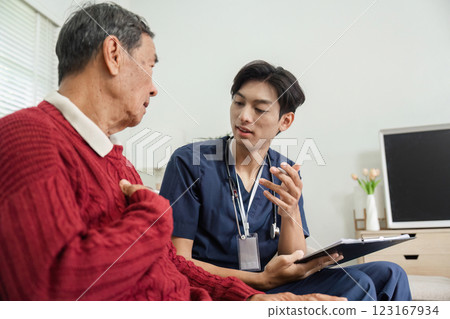 Nurse discussing health status with elderly patient during a home visit consultation Nurse discussing health status with elderly patient during a home visit consultation 123167934