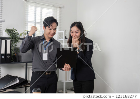 Business colleagues discussing project results in a bright office, highlighting teamwork and engagement. 123168277