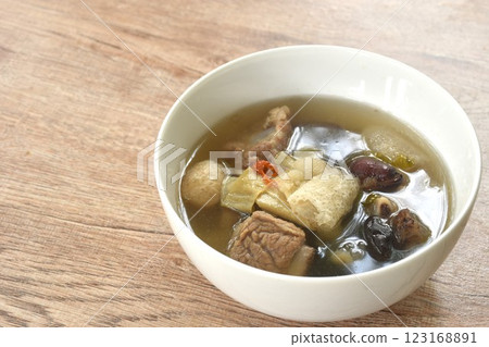 boiled bamboo mushroom with pork bone and black ear mushroom in clear Chinese herb soup on bowl 123168891