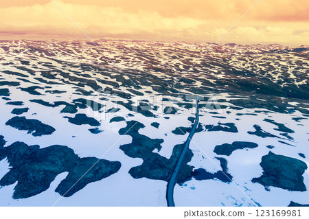 Aerial view of snow covered mountain in summer. High mountain road Bjorgavegen. Aurlandsvegen, Aurland, Norway 123169981