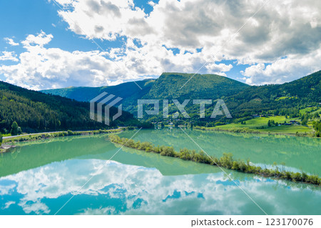 Top view of the shore of the beautiful mountain lake Lalmsvatnet on a sunny day Top view of the shore of the beautiful mountain lake Lalmsvatnet on a sunny day 123170076