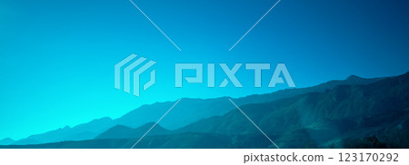 Silhouette of mountains against the blue sunset sky. Horizontal banner 123170292