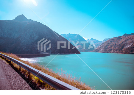 View of mountain lake and highway in autumn. Koelnbreinspeicher Gamskarnock, Carinthia, Austria Europe 123170316