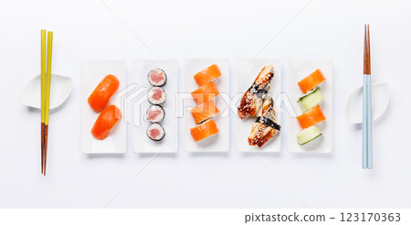 Assorted sushi and maki rolls beautifully arranged on plates 123170363