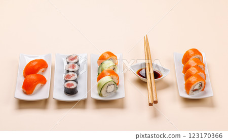 Assorted sushi and maki rolls beautifully arranged on plates Assorted sushi and maki rolls beautifully arranged on plates 123170366