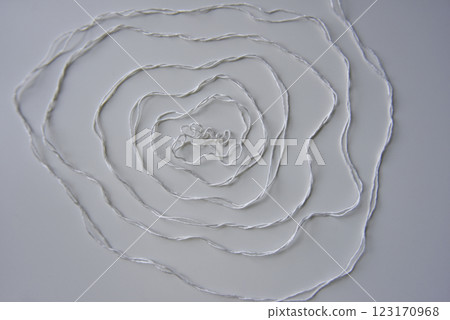 the spiral pattern of the white thread the spiral pattern of the white thread 123170968