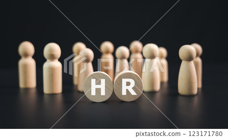 Hr, HRM, Human resources management recruitment concept, HR letters on a wooden plate with wooden dolls on a black background, Teamwork leadership concept, Recruitment and customer target group. 123171780