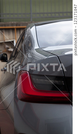 Detail of luxury car headlights lamp, grey modern car tail red lamp 123171847