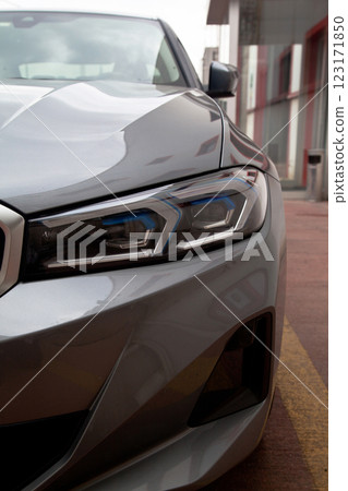 Detail of luxury grey car headlights lamp, modern car front lamp Detail of luxury grey car headlights lamp, modern car front lamp 123171850