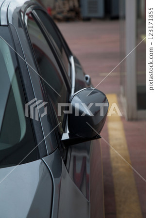 Side view of a luxury gray sedan model car from 2024 production, folding mirror details Side view of a luxury gray sedan model car from 2024 production, folding mirror details 123171855
