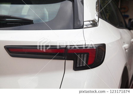 Detail of luxury car headlights lamp, white modern car tail red lamp 123171874