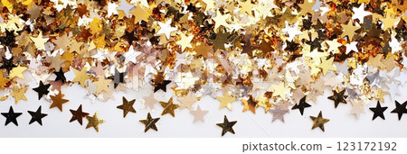 Scattered gold confetti stars on white background Scattered gold confetti stars on white background 123172192