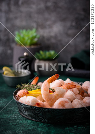 Frozen uncooked prawns or shrimps with lemon 123172359