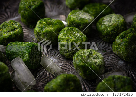 Frozen spinach green cubes in bowl Frozen spinach green cubes in bowl 123172430