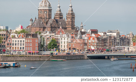 Aerial cityscape with the Basilica of Saint Nicholas in Amsterdam's Old Centre near the Central Station timelapse. Aerial cityscape with the Basilica of Saint Nicholas in Amsterdam's Old Centre near the Central Station timelapse. 123172877