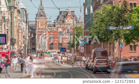 Damrak Street heading from Dam Square to Centraal Station in a timelapse with electric tram. Amsterdam, Netherlands 123172881