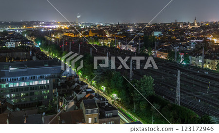 Aerial night timelapse of Brussels North station railway tracks with trains arriving and departing. Belgium Aerial night timelapse of Brussels North station railway tracks with trains arriving and departing. Belgium 123172946