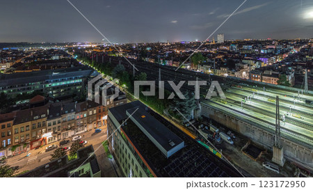 Aerial night timelapse of Brussels North station railway tracks with trains arriving and departing. Belgium 123172950