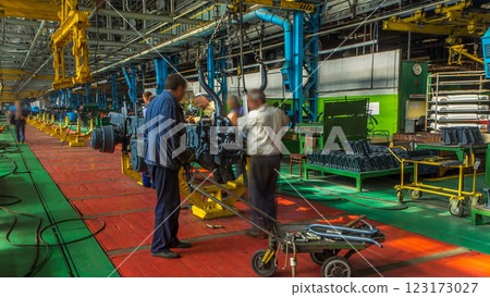 Conveyor assembly stage the body of tractor at big industrial factory timelapse 123173027