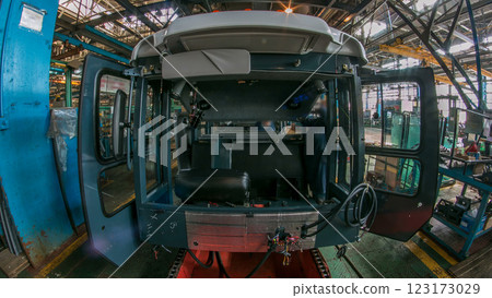 Conveyor assembly stage the body of tractor at big industrial factory timelapse Conveyor assembly stage the body of tractor at big industrial factory timelapse 123173029