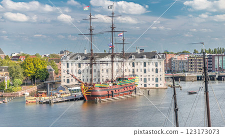 Aerial timelapse of the National Maritime Museum with the sailboat replica Amsterdam docked nearby. Amsterdam, Netherlands 123173073
