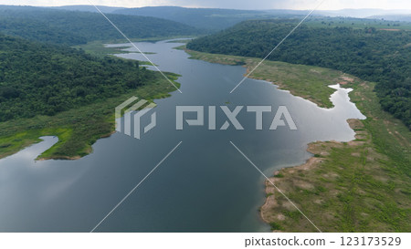 Drone shot. Aerial view scenic landscape of a large river delta amid a lush forest at the tropical Asia place 123173529