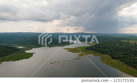 Drone shot. Aerial view scenic landscape of a large river delta amid a lush forest at the tropical Asia place 123173530